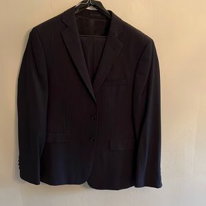 Black pin stripe suit made by Calvin Klein 42S jacket and 32 pants